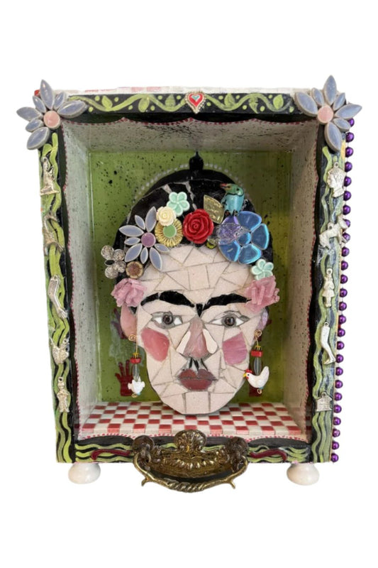 Frida inspired mosaic with cut glass and tile found objects in a hand painted shadowbox