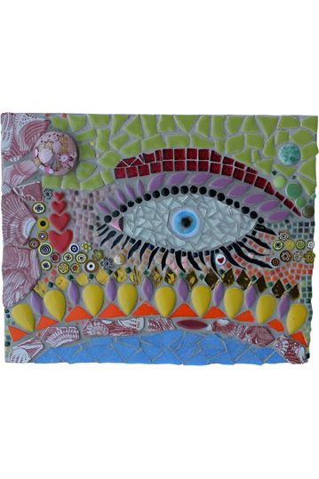 “Spirit Eye” mosaic blends cut glass tile and radiant color to create a powerful protective symbol that’s both mystical and modern inspired by ancient traditions that ward off evil and invite clarity