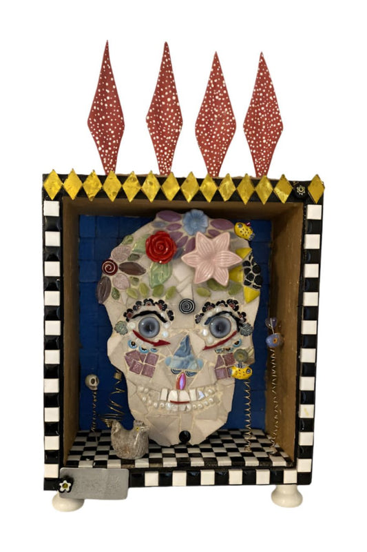 Mosaic skull with cut glass tile and mixed media embellishments in a handpainted shadow box